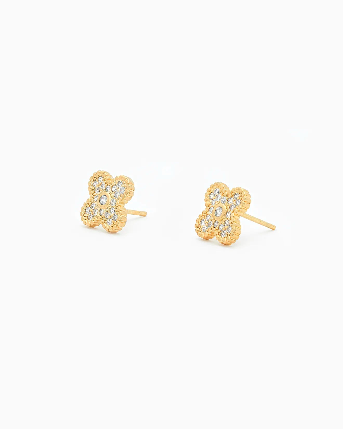 Gold earrings with floral design on a white background