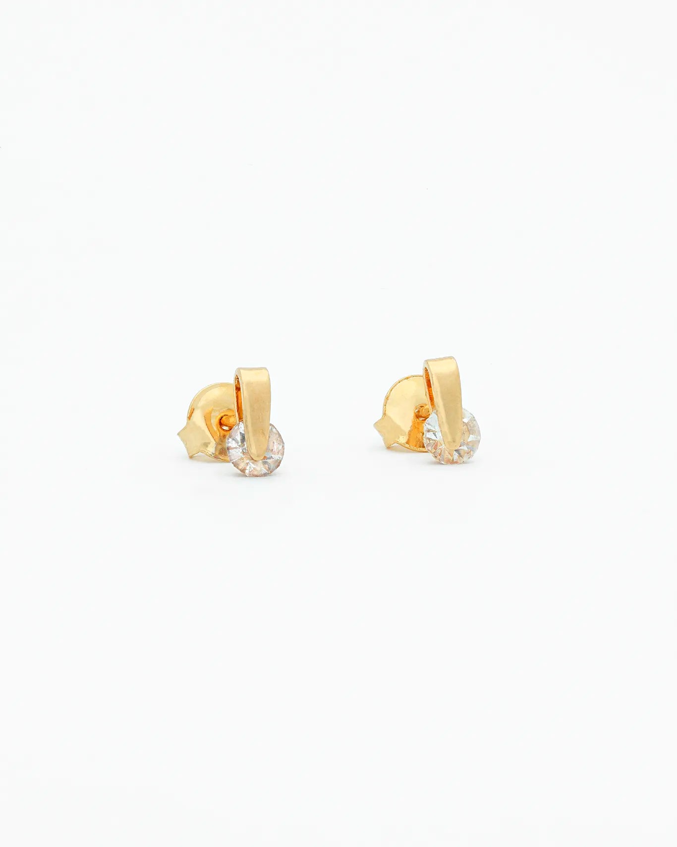Gold hoop earrings on a white background