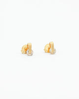 Gold hoop earrings on a white background