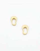 Two gold earrings on a white background