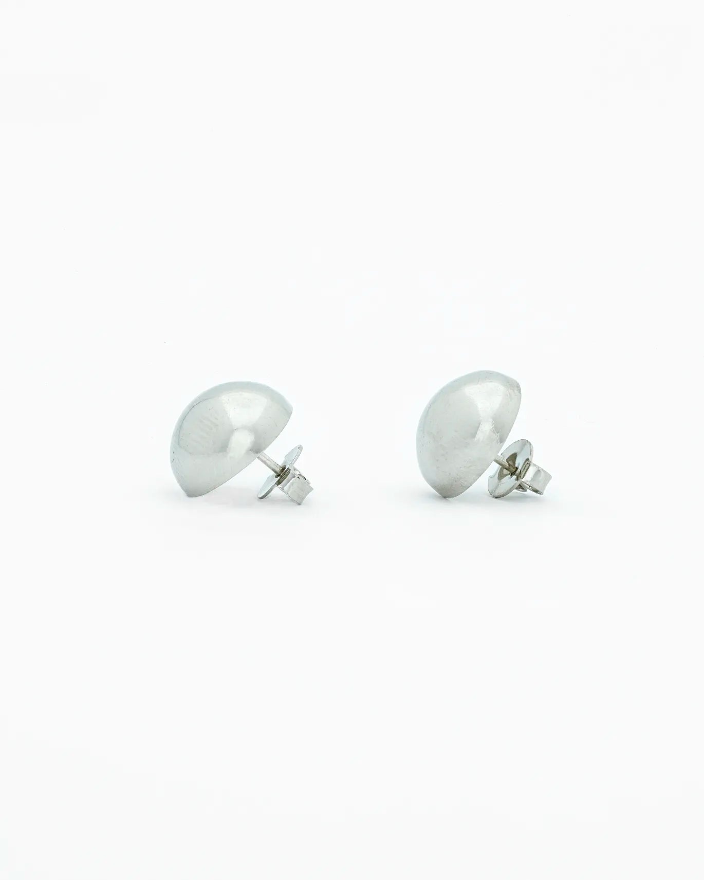 Pair of silver earrings on a white background