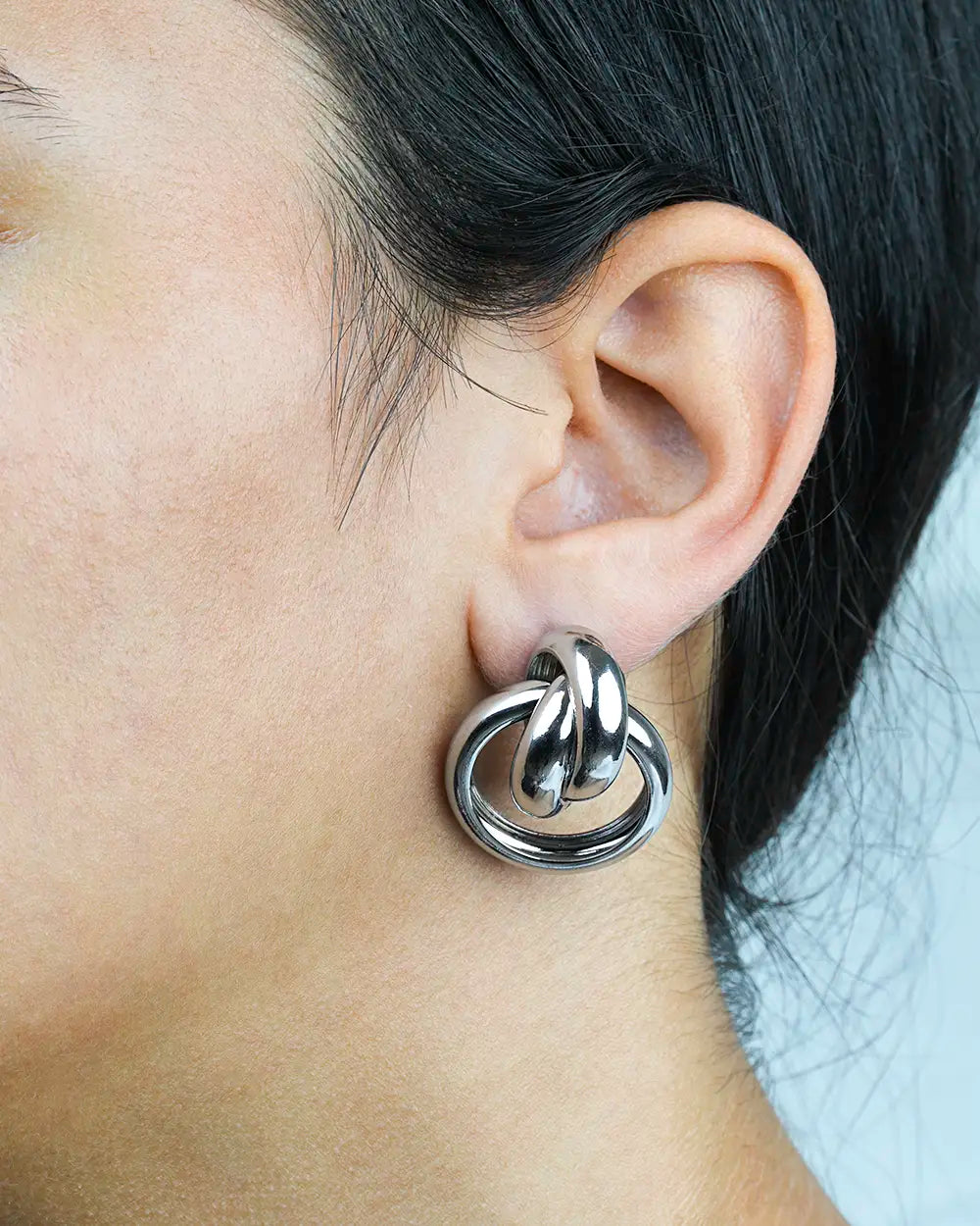Model Wearing a Rhodium filled Knot Earrings Mid ES2400065
