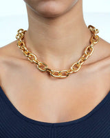 Woman wearing a thick rolo gold chain