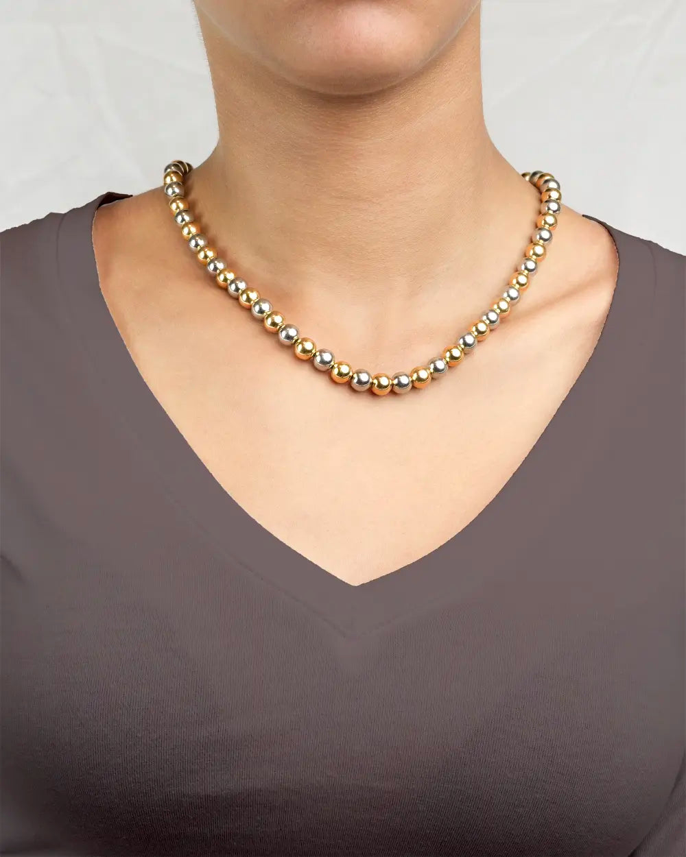 Model  wearing Two-Toned Gold Silver Beaded Chocker