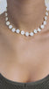 Woman wearing a pearl chocker