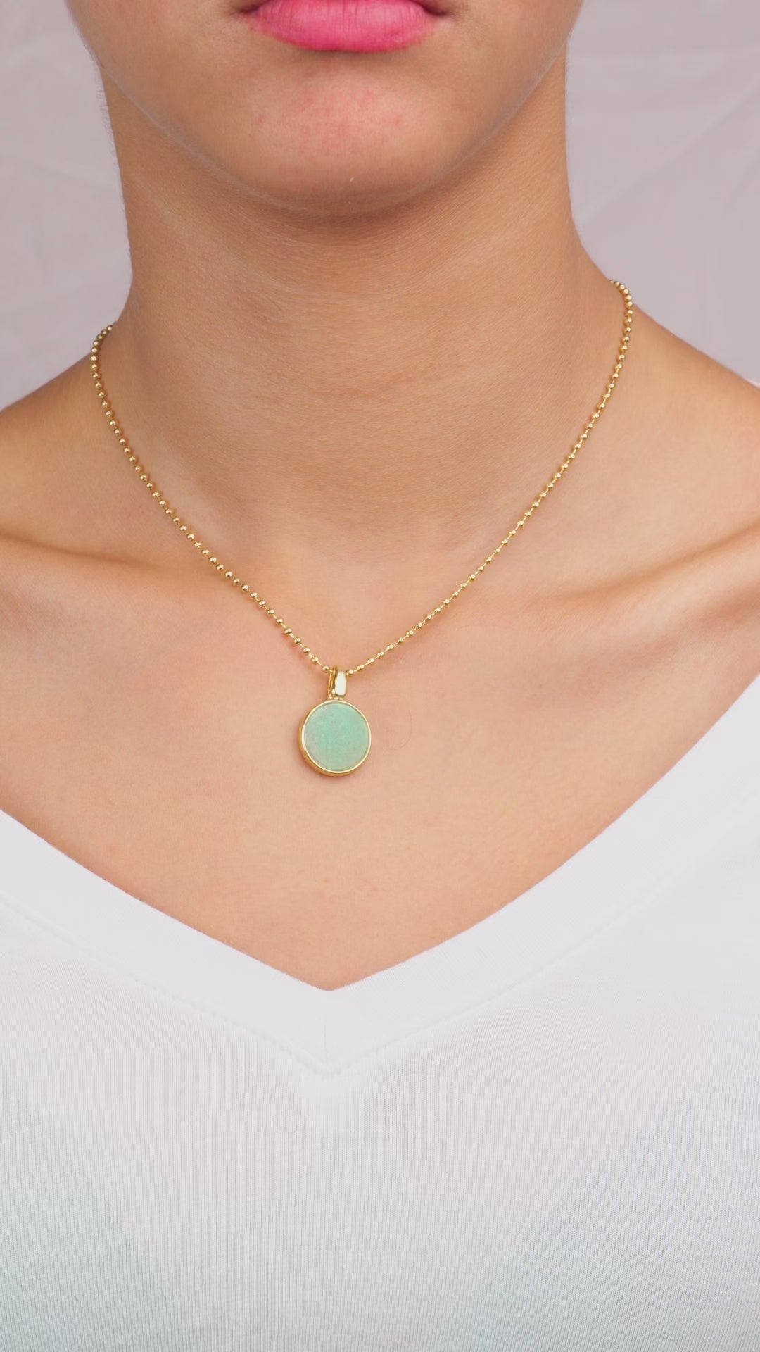 Model Wearing gold green pendant 