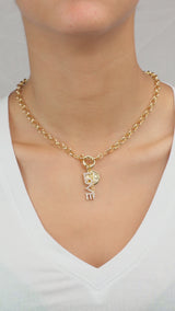 video on model wearing the love and key necklace